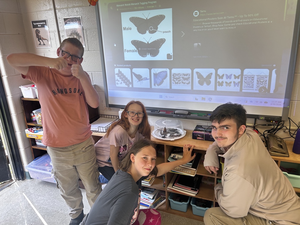 Students wait for the monarch to emerge.