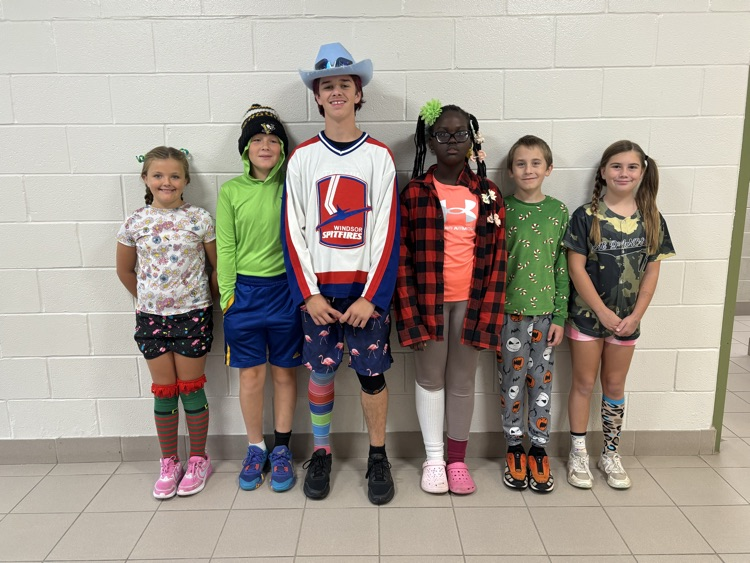 a collection of students wearing mismatched clothing