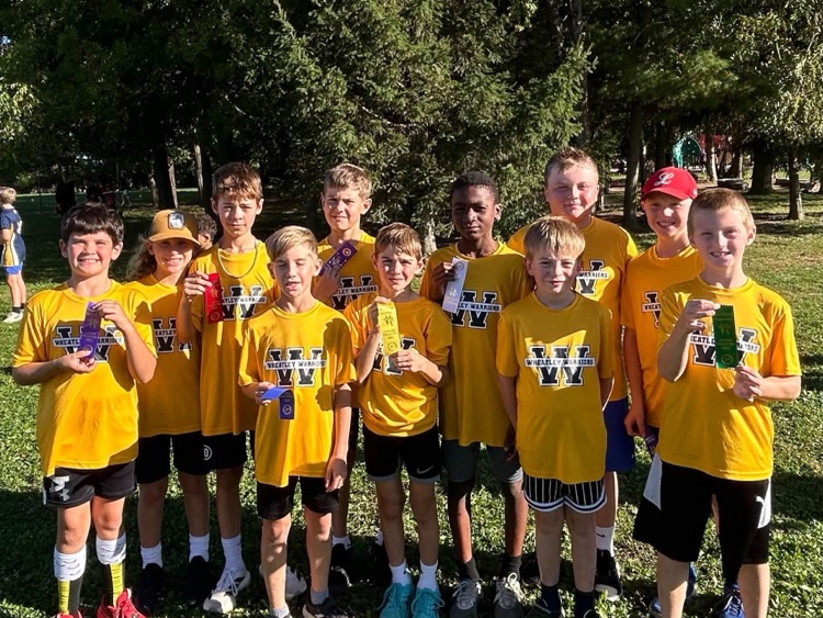 Boys cross-country team with the ribbons