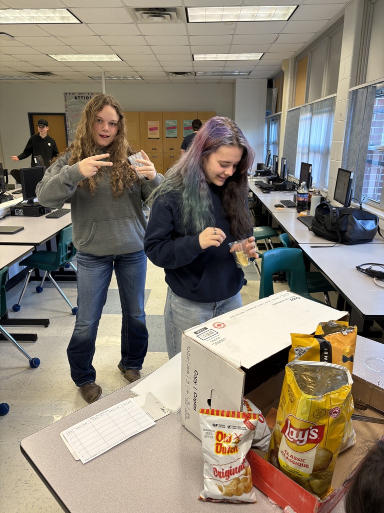 Students comparing three different brands of potato chips!
