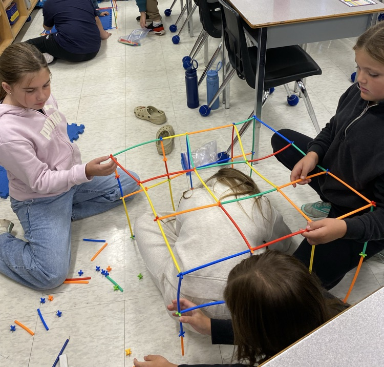 3 students during a build a house challenge 
