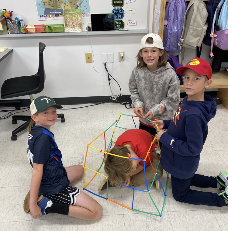 3 boys using straws and connectors in the build a house challenge 