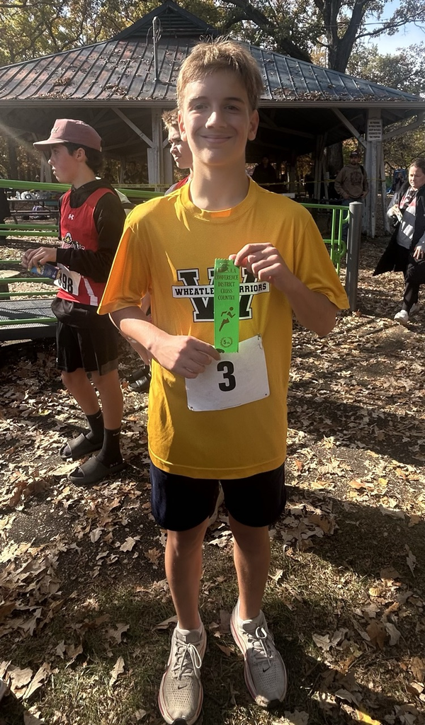 grade 8 male runner with his 5th place ribbon 