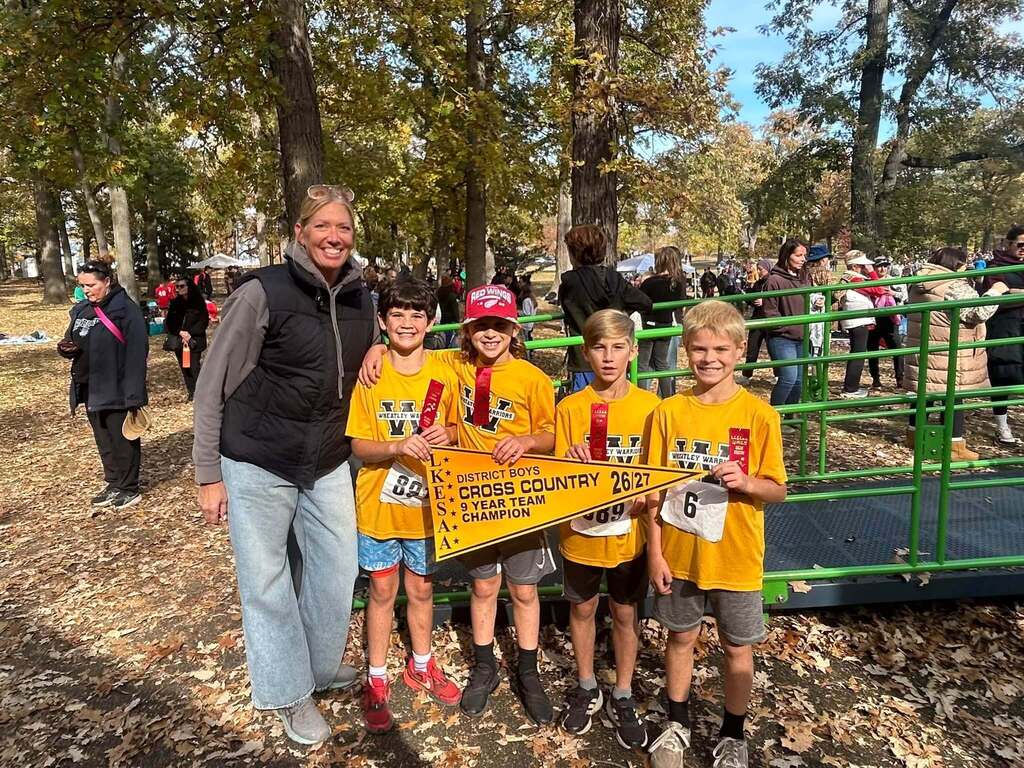 Mrs. Brown our cross country coach with the Grade 4 team winners- 4 boys