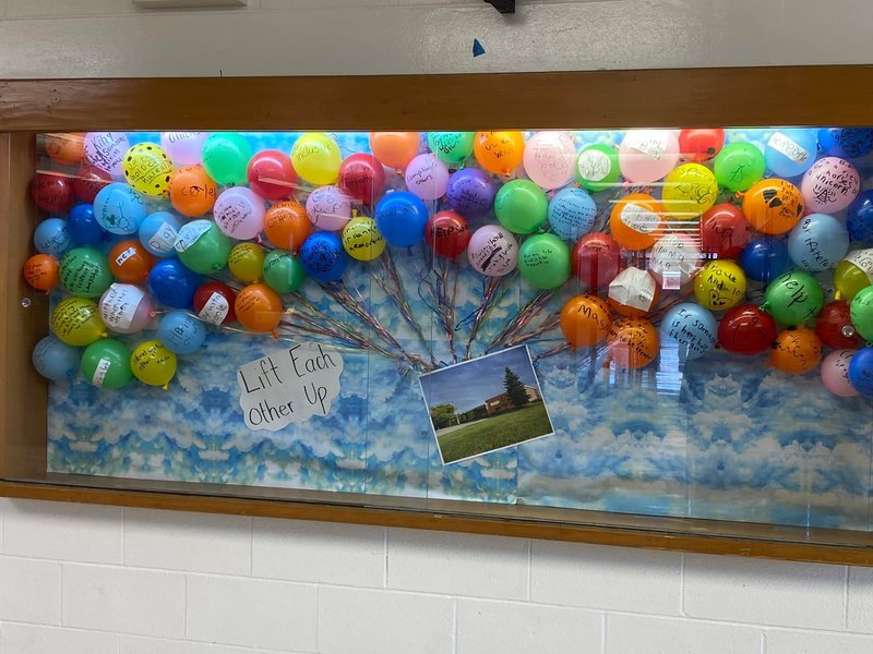 lift eachother up balloon display