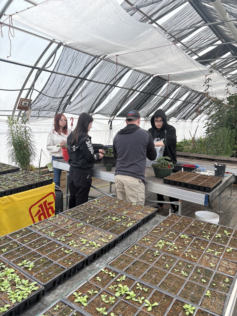 students in green house