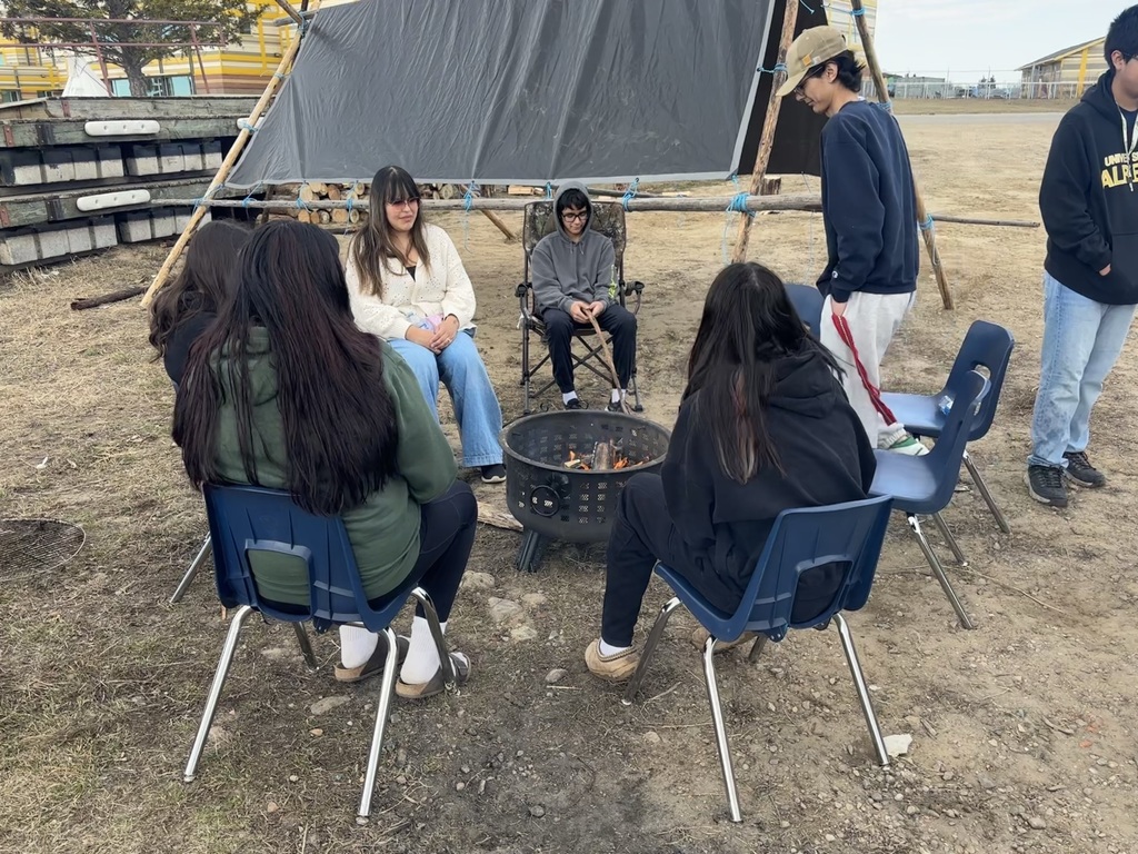 students at lake front