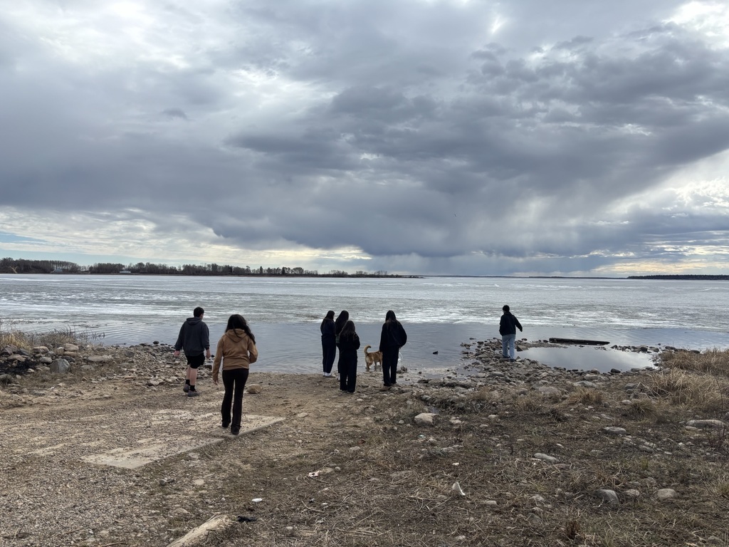 students at lake front