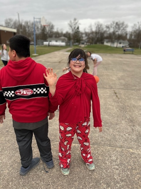 smiling girl waving