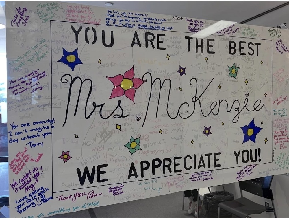 A poster with flowers and signatures for OC appreciation day