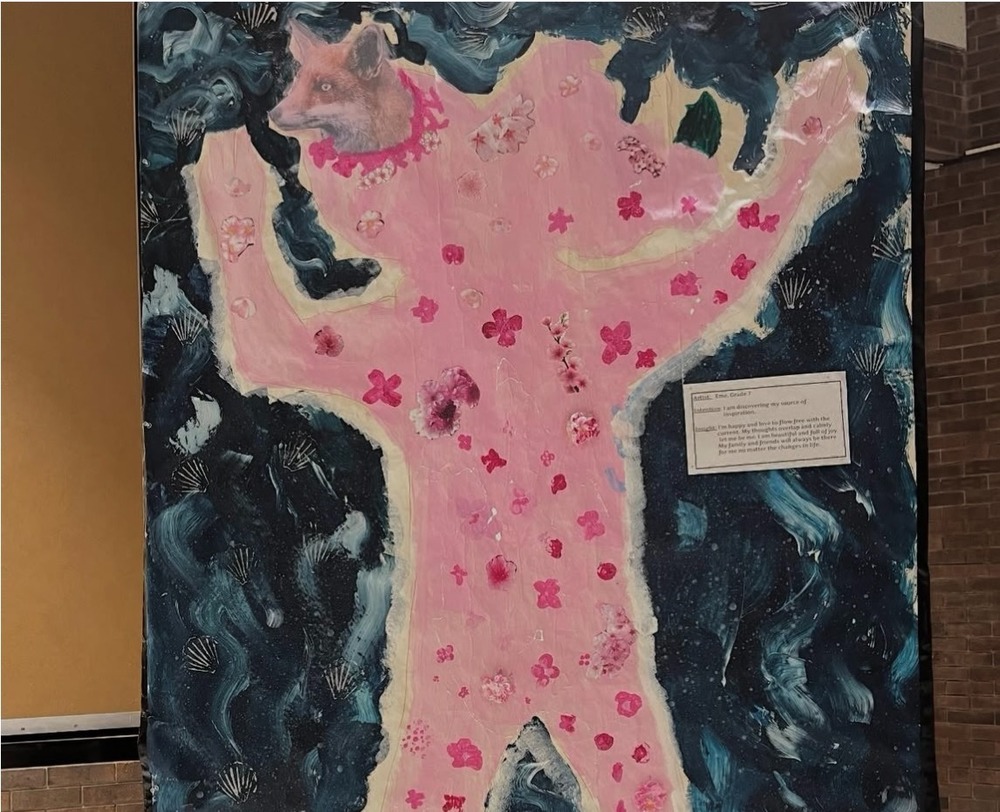 Student artwork mural; outline of student body, painted pink with florals and shells. Blue background.