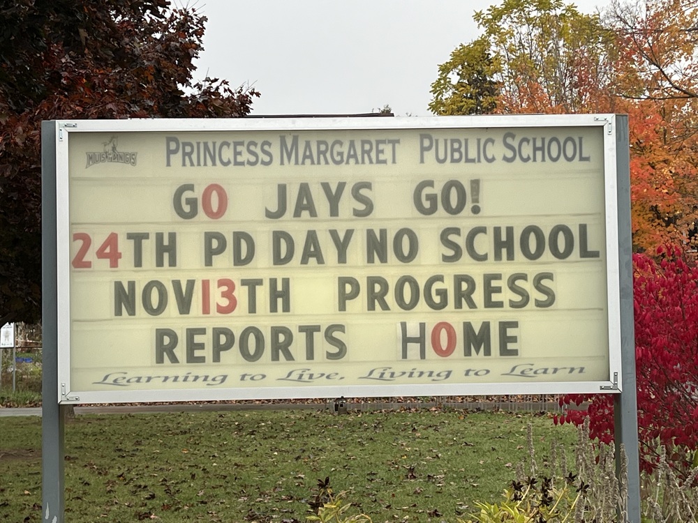 school sign with school logo that is a horse with important dates