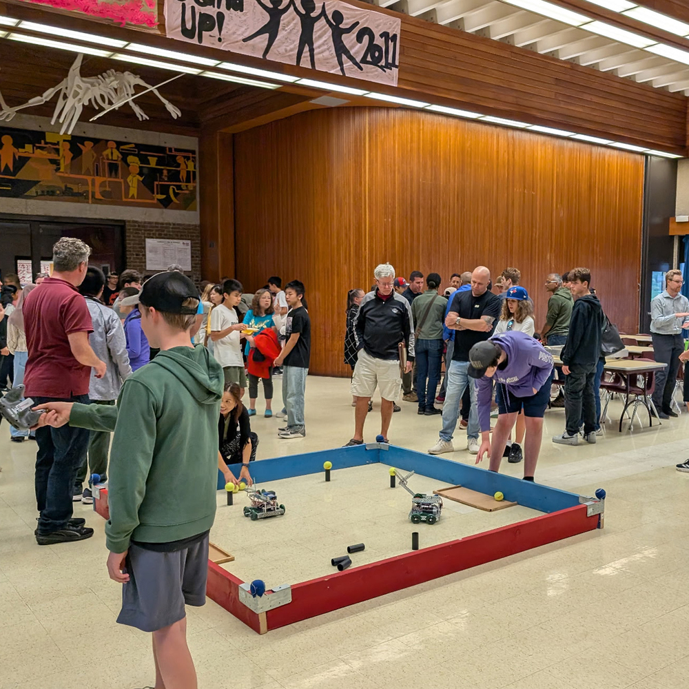 Students attend a Robotics team open house.