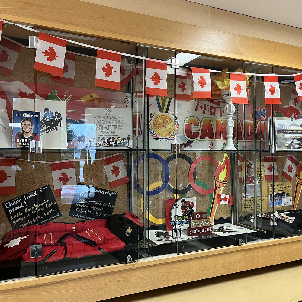 A display case full of Canadian Olympic and Paralympic items.