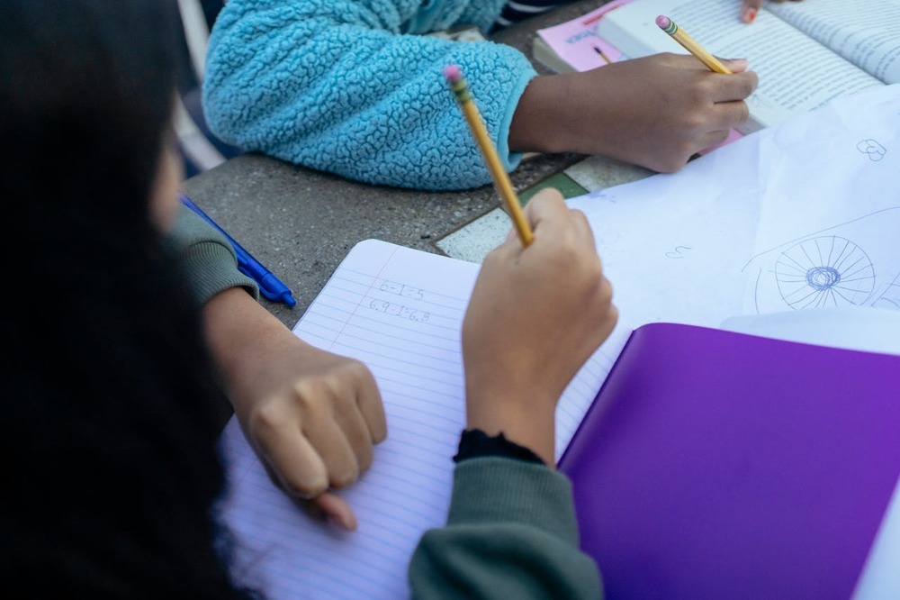 This photo features students doing school work. 