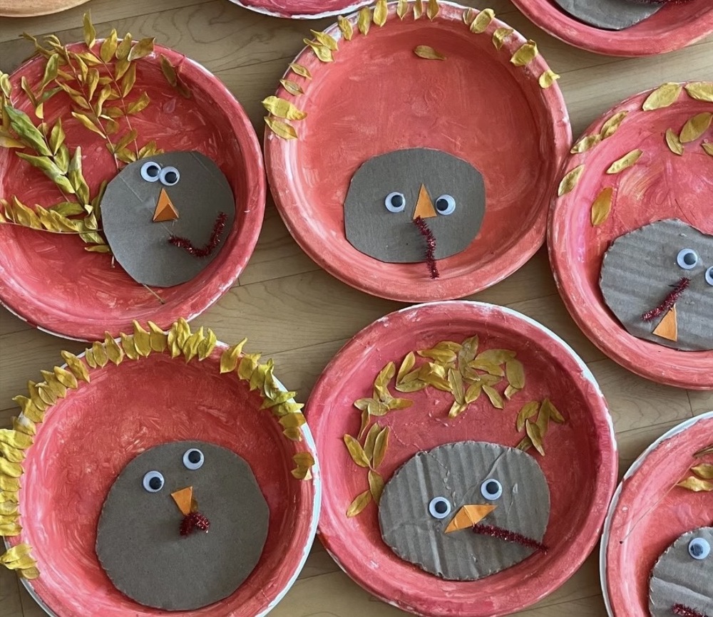 Turkeys: red paper plates, leafs as feathers, brown cardboard for head, googly eyes, orange beak, and a red pipecleaner wobble. 