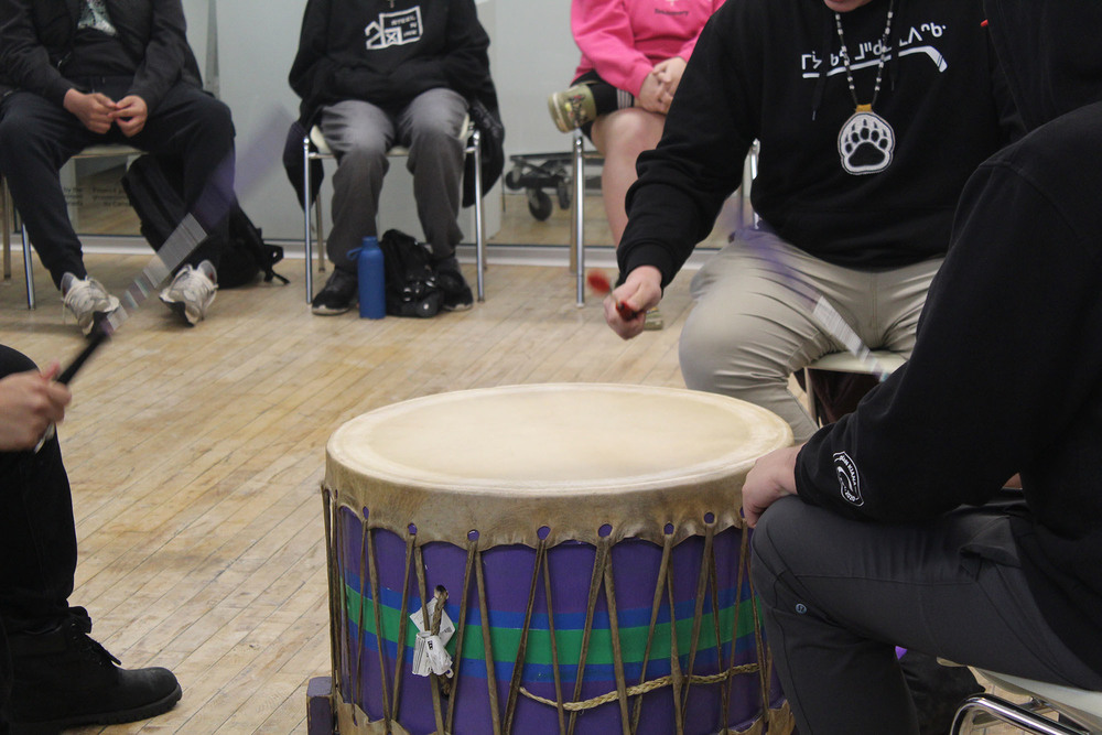 Walking bear singers drumming