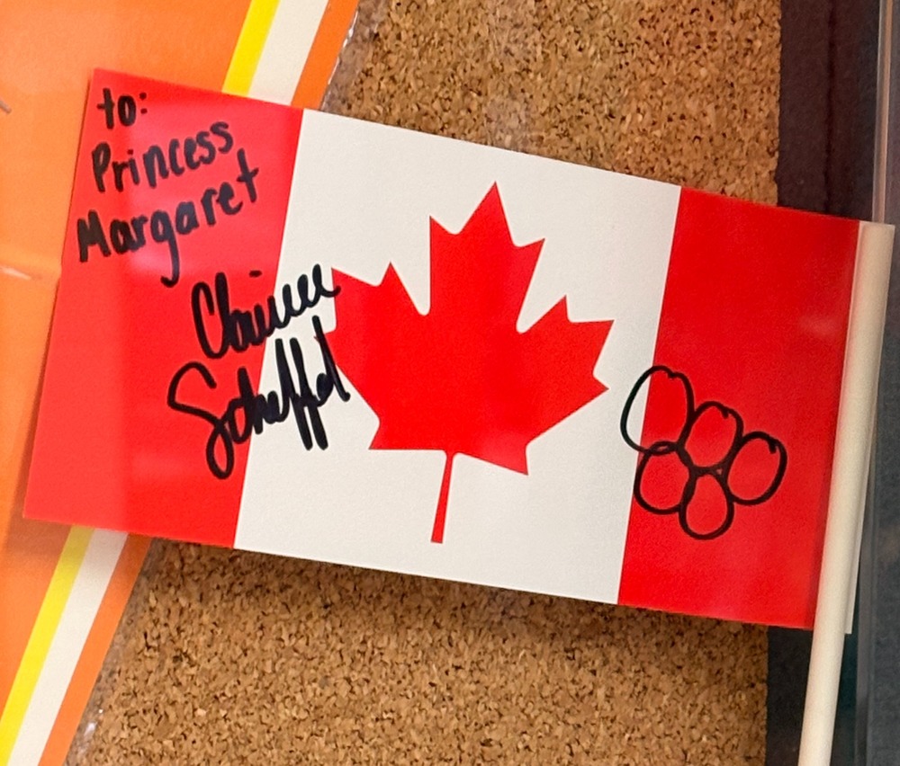 Canadian flag signed by an Olympian to Princess Margaret with Olympic rings (all in black)