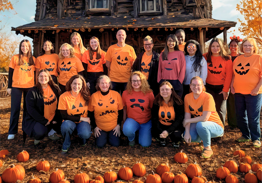 People dressed up as pumpkins for Halloween. 