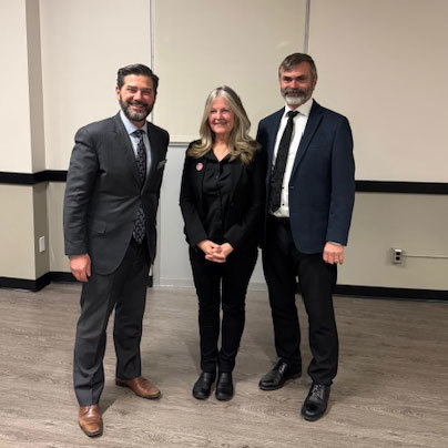 3 people pose for a photo.