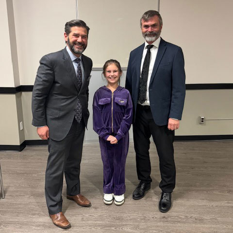 3 people pose for a photo.