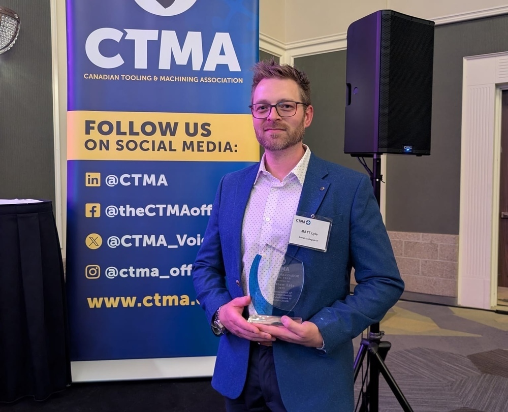 Matt Lyle pictured holding an award