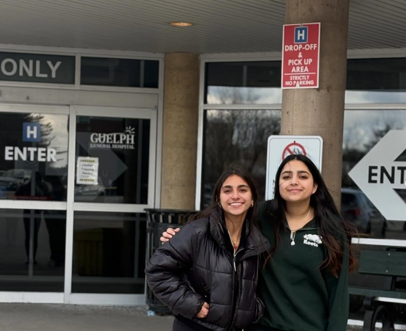 Two students in front of Guelph General Hospital