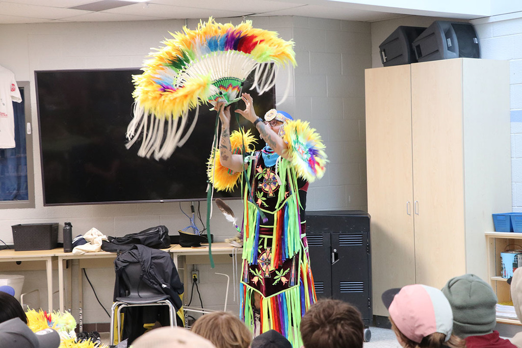 a photo of classic roots showing students his regalia