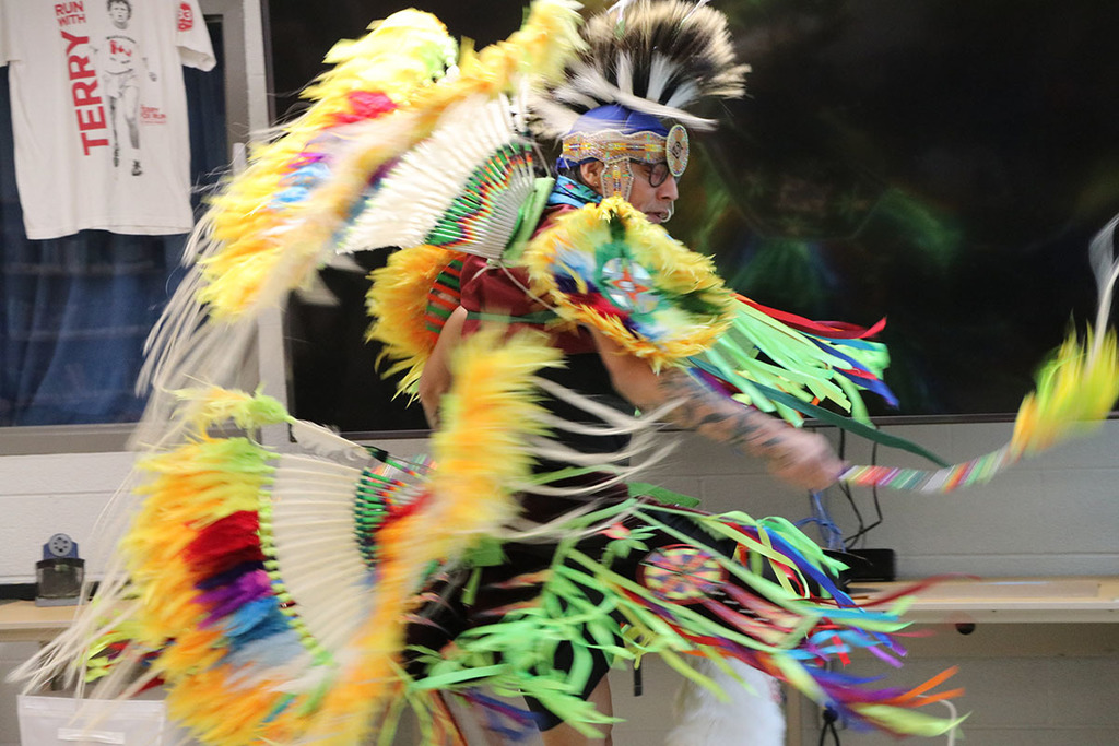 A photo of Classic Roots dancing in his regalia