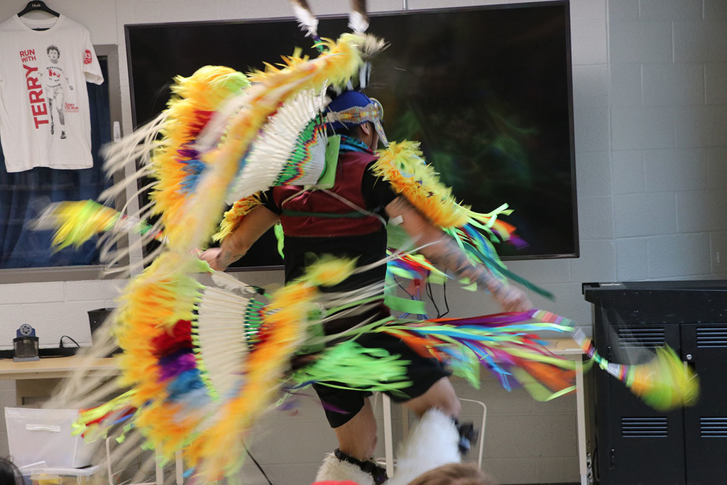 A photo of Classic Roots dancing in his regalia