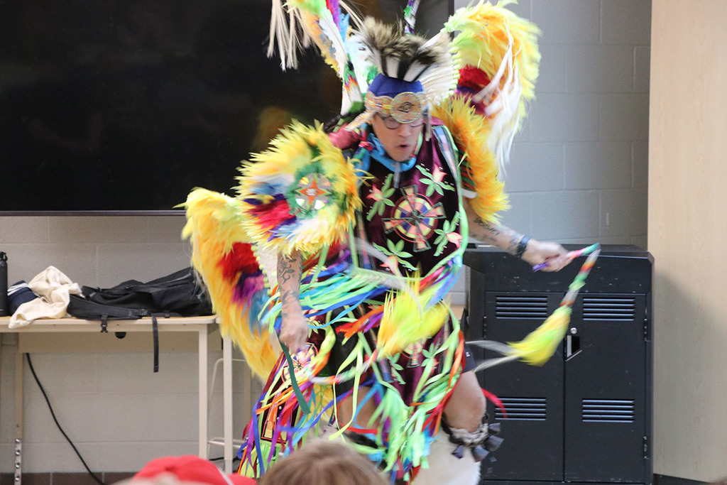 A photo of Classic Roots dancing in his regalia