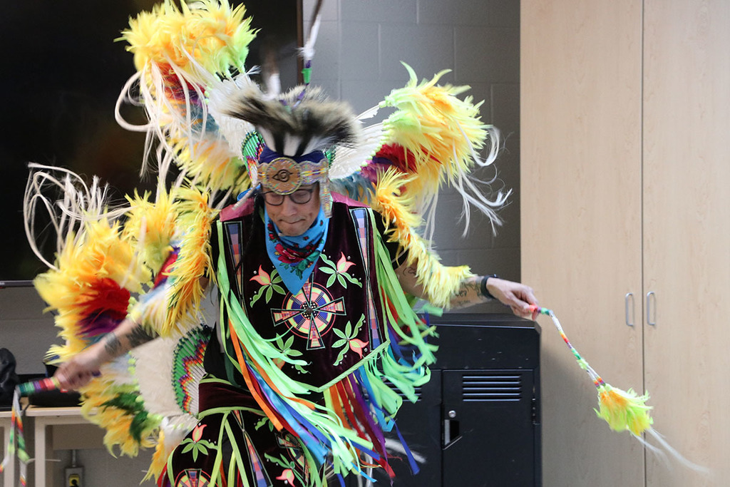 A photo of Classic Roots dancing in his regalia