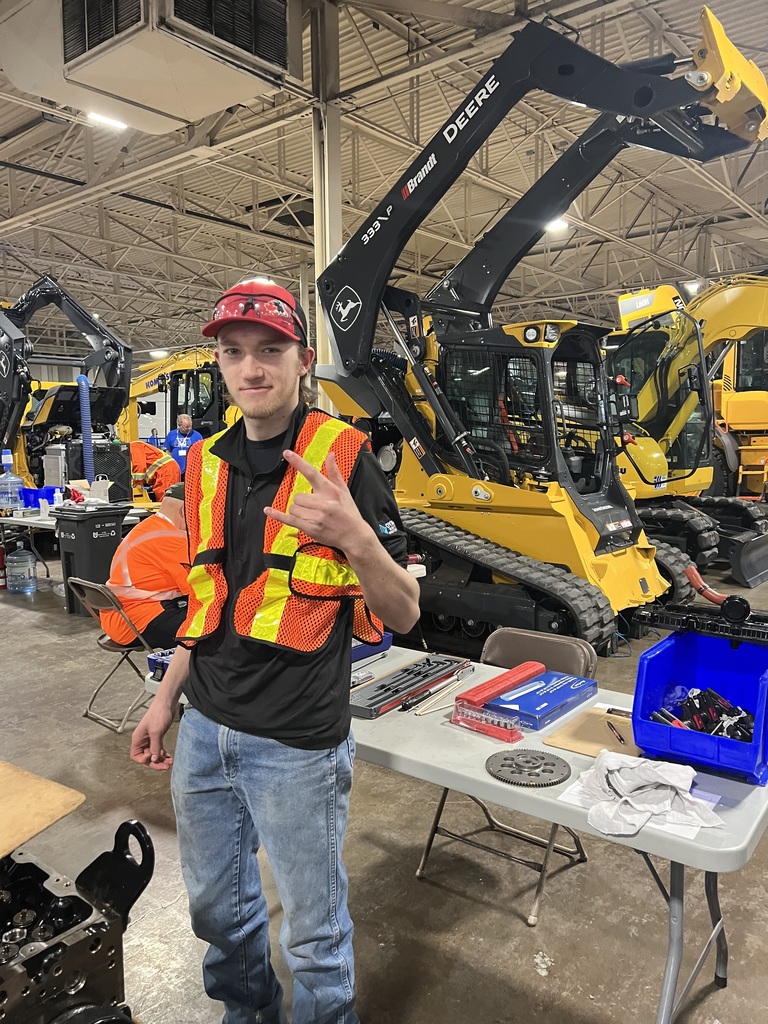 a student with heavy equipment at skills
