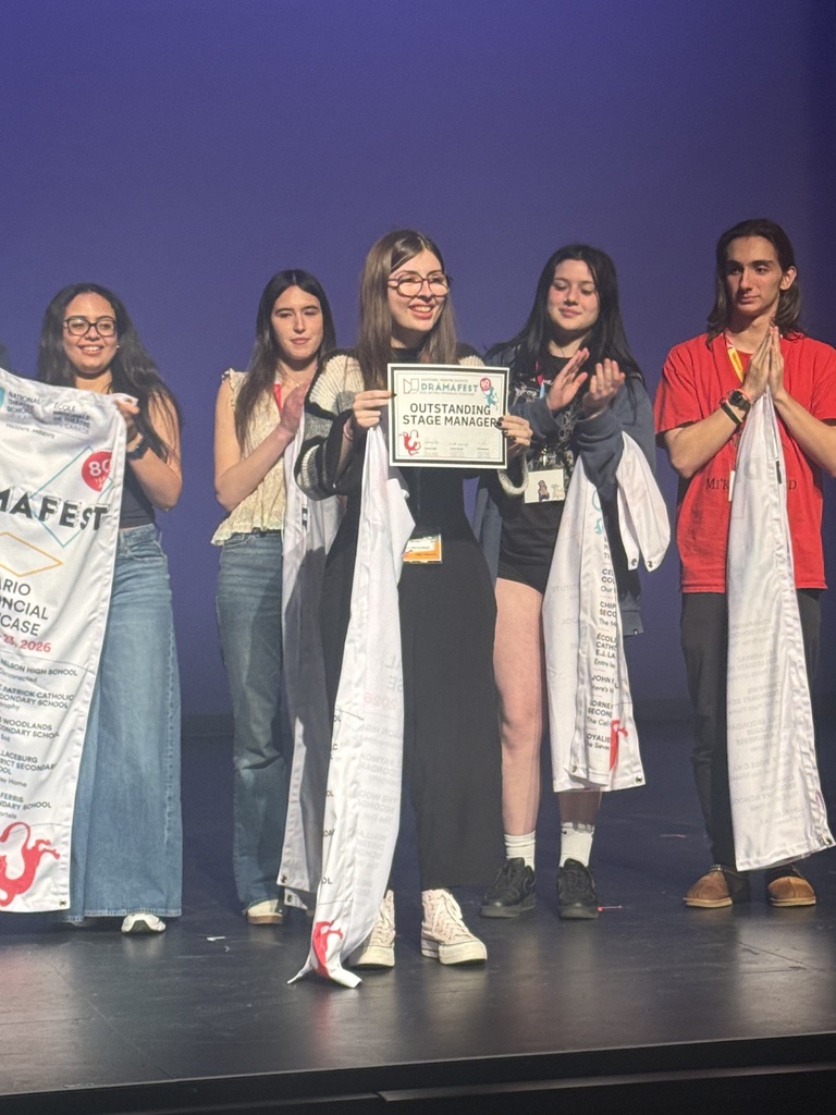 a student holding an award at NTS DramaFEST