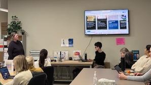 Woman speaking to group of people