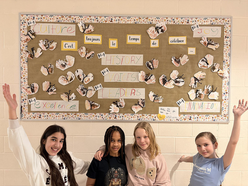 Guelph Lake students with bulletin board