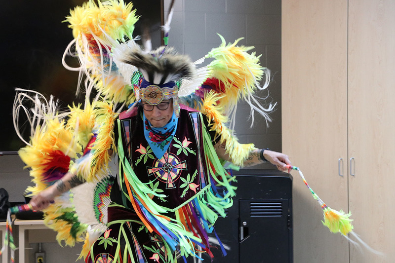 A photo of Classic Roots dancing in his regalia