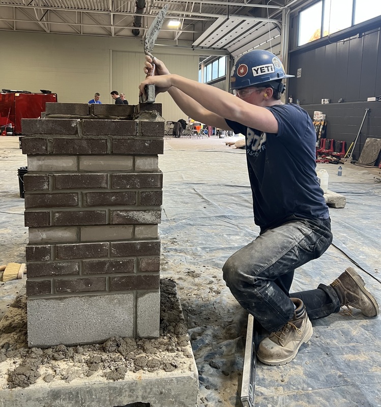 a student with bricks at skills