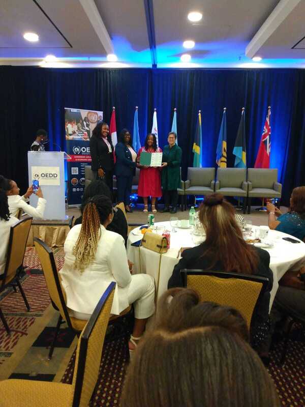 A photo of the student accepting the award