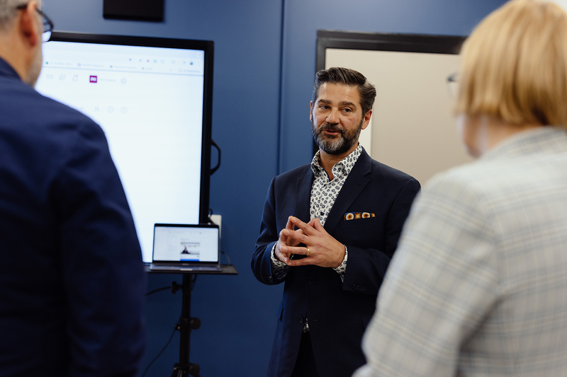 Director of Education Sovran speaks to Minister Calandra and Sylvia Jones.