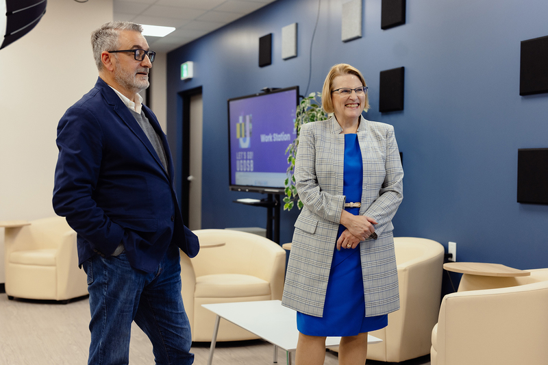 Paul Calandra and Sylvia Jones standing in a room.