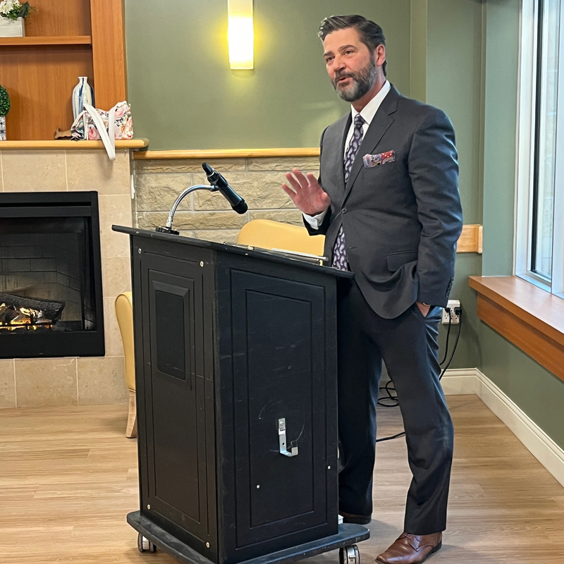 A man stands at a podium.